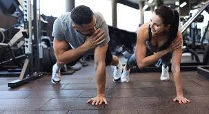 Toning Bingo Wings: Your Ultimate Guide to Sculpting Sleek Arms at the Gym 3 Fitness trainer demonstrating arm toning exercises Beccles