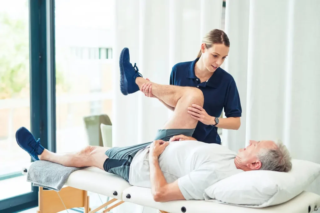Revitalising Recovery: Effective Rehabilitation Strategies for Muscle Injuries 3 Physiotherapist assisting a patient with muscle recovery exercises Beccles
