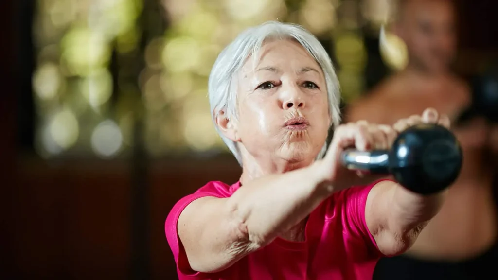 Toning Bingo Wings: Effective Exercises and Tips for Achieving Sleeker Arms 2 Person performing arm exercises with dumbbells Beccles