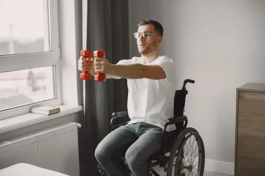 Image of man doing exercise in his wheelchair to aid weight loss Beccles