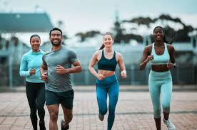 Sculpting Sleek Arms: The Essential Role of Cardio in Toning Without Bulking Up 3 image of people running to incorporate cardio Beccles exercise into their life to help tone arms and body.